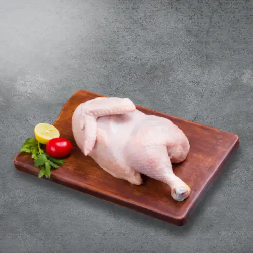 Haritha Hari Half Chicken with a tomato and a lime